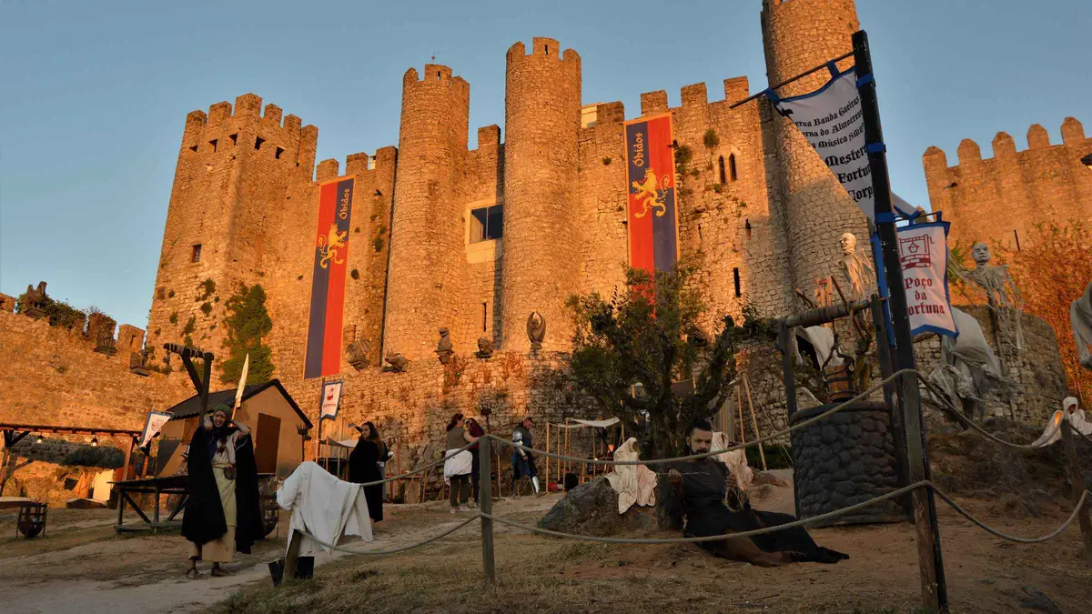 Whitewashed medieval streets inside the walls of Óbidos on a guided walking tour from Sintra