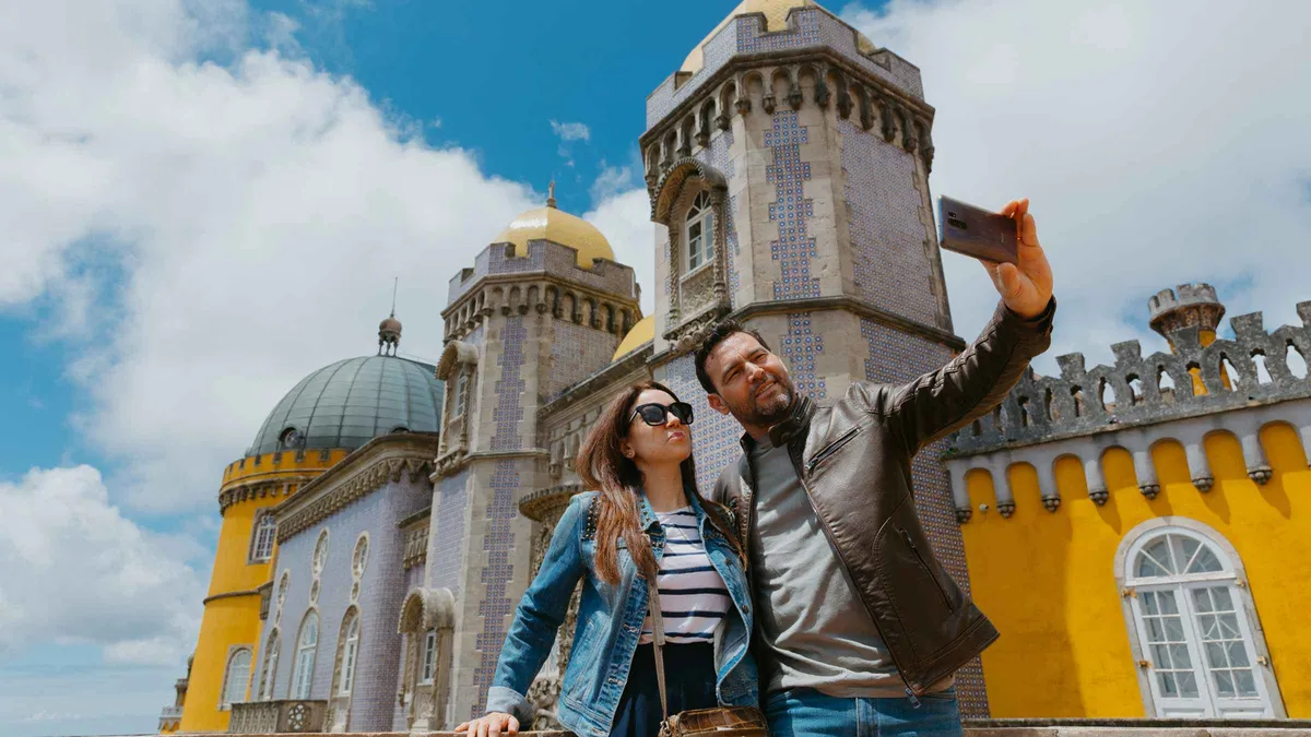 Small tour group at Cabo da Roca cliffs on a Sintra and Cascais day tour from Lisbon