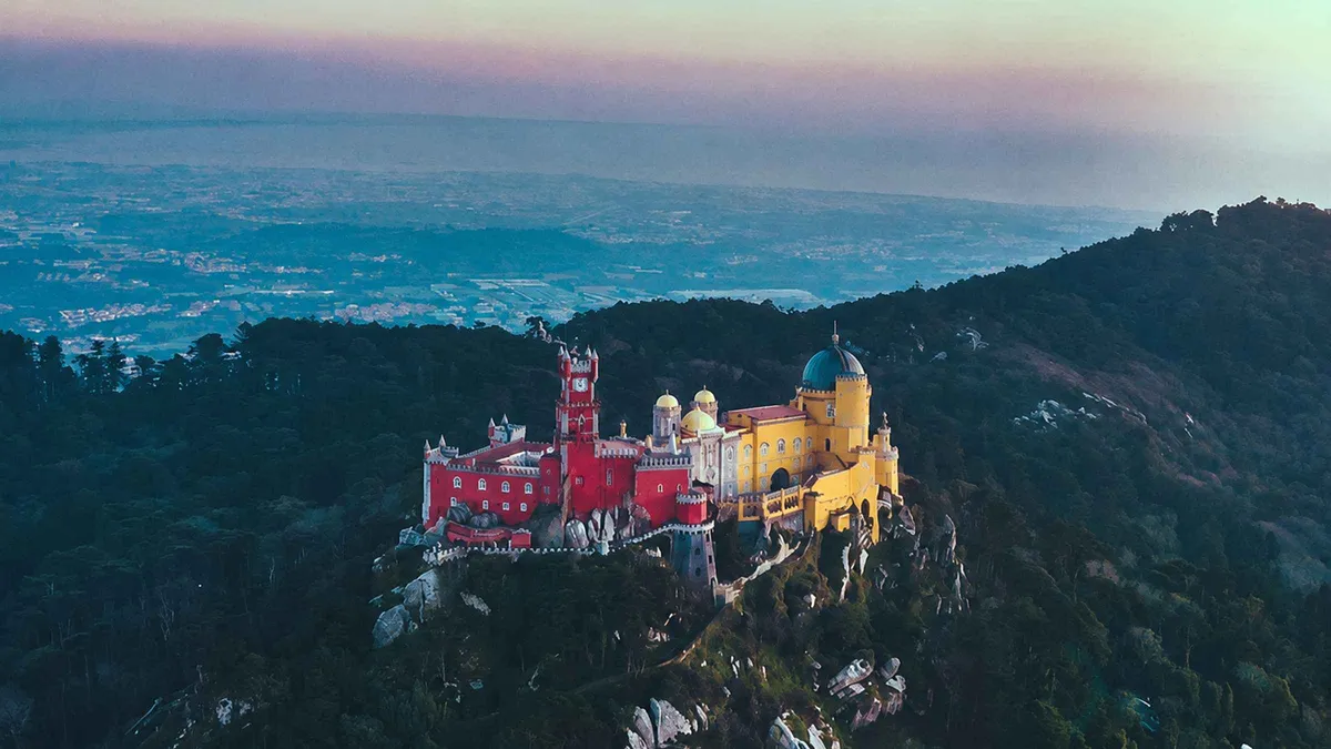 Guide leading a small group through Sintra's historic centre on a half-day Pena Palace and Regaleira tour